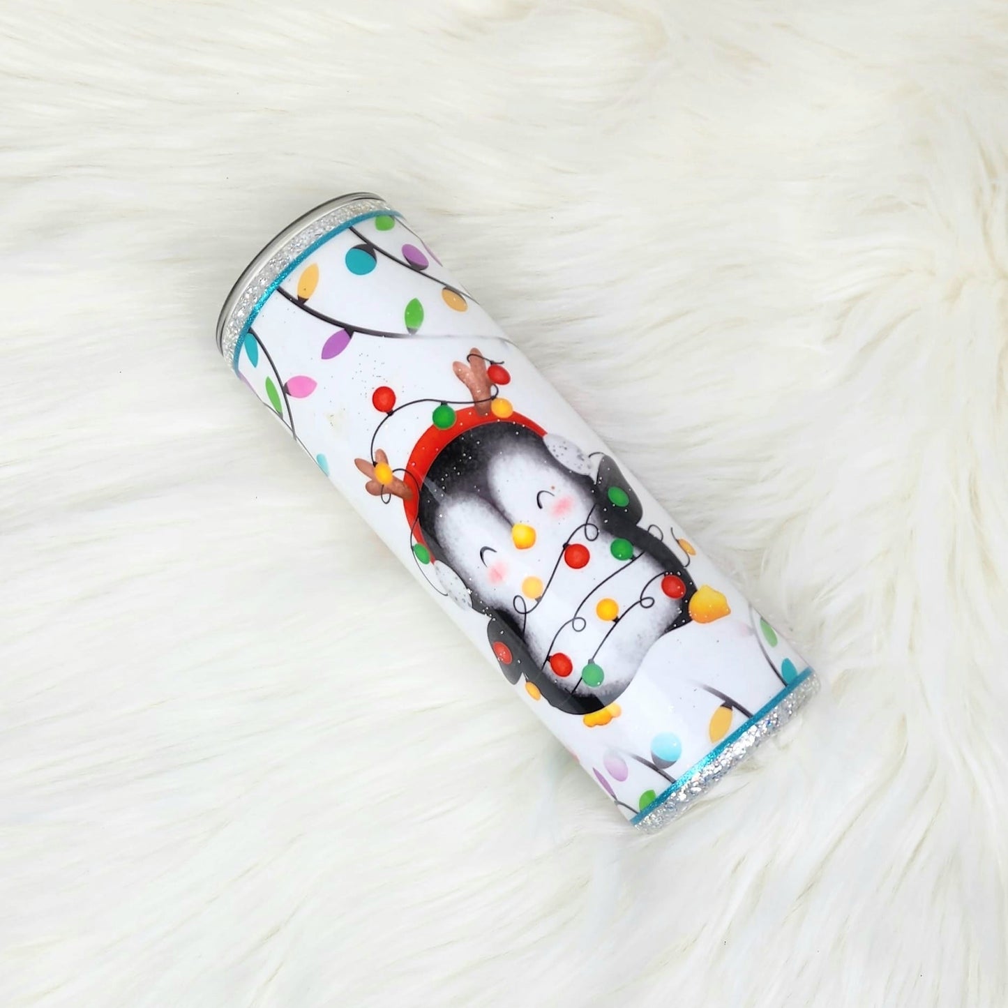Cute penguin with tangled Chirstmas lights and glitter tumbler cup
